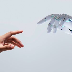Human hand reaching out to touch a robot hand 