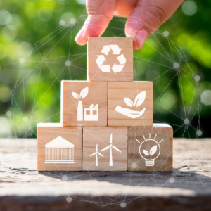 Building blocks showing environmentally friendly logos symbolizing board members way of thinking in boardroom
