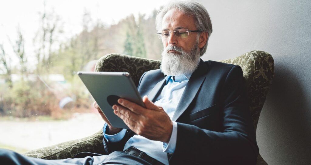 director using his board portal app to access board agenda minutes